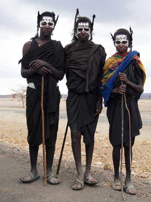 3 young men with painted face